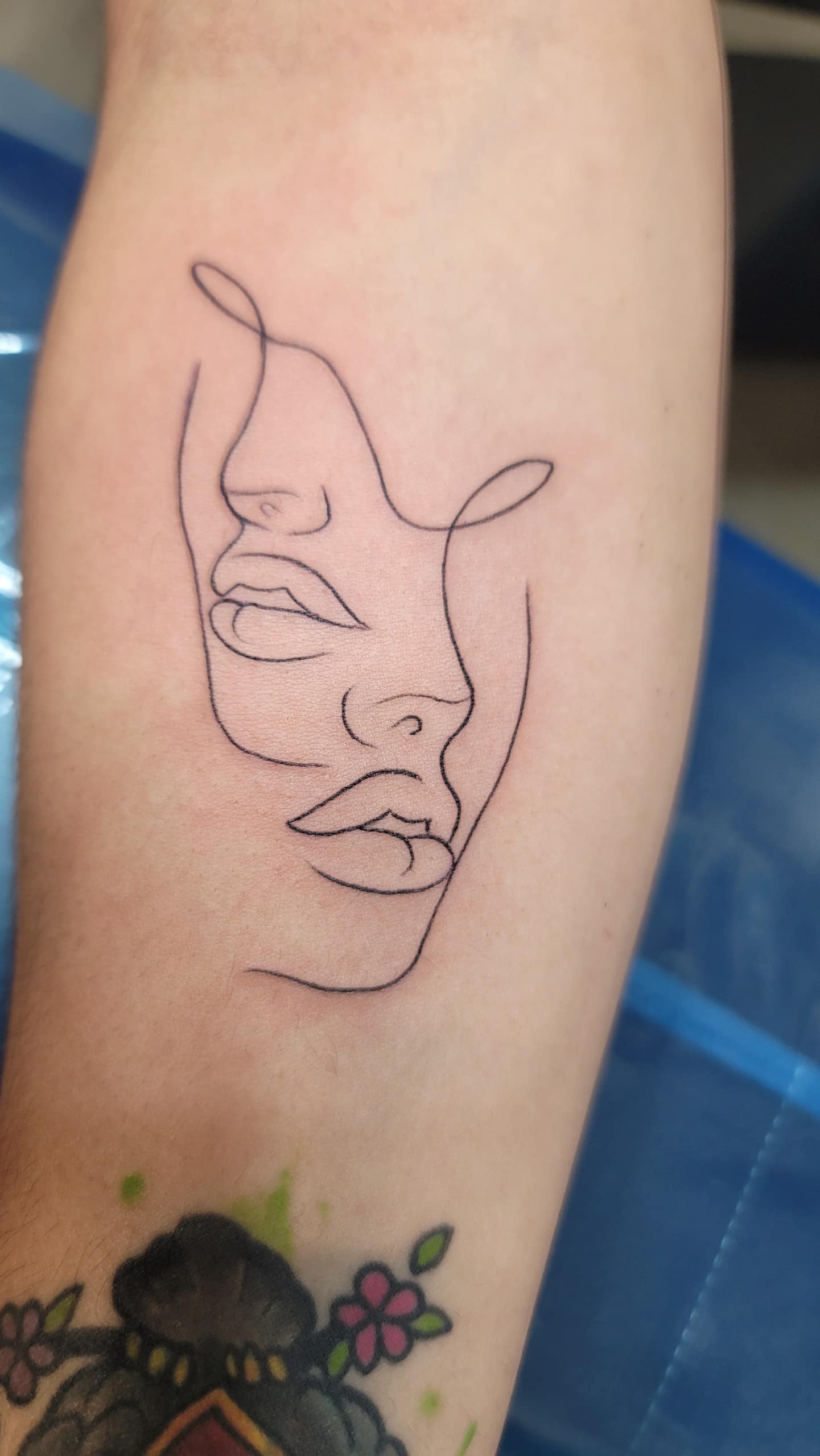 a close up of a tattoo on their face