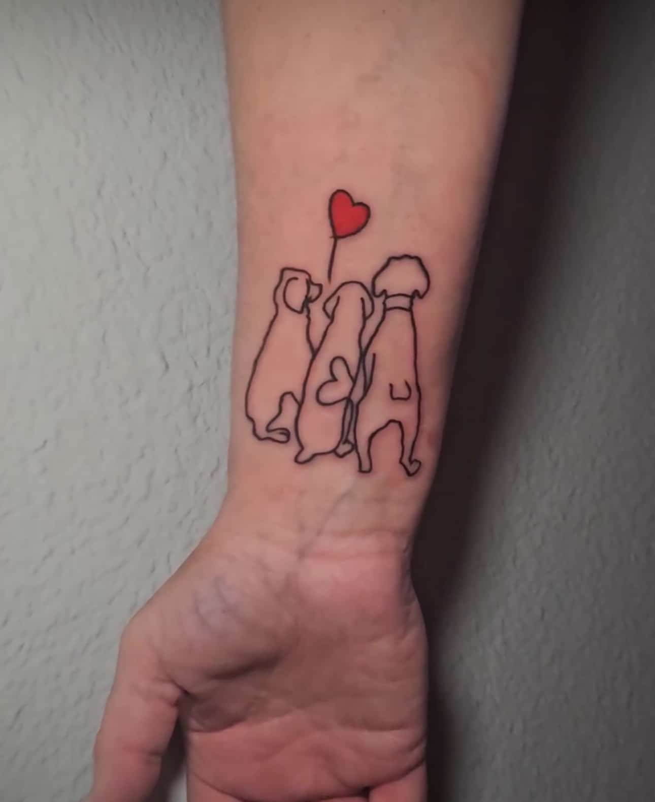 a person holding a tattoo